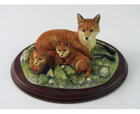 A Border Fine Arts figure Family Portrait of foxes, B038, on wooden base, 20cm wide, (boxed).