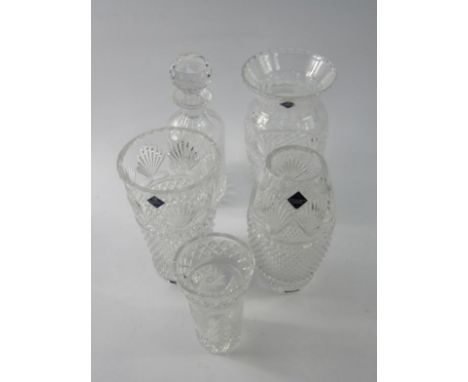 An Edinburgh crystal cut glass decanter and stopper, three cut glass vases, all boxed, and one further vase,  (5).