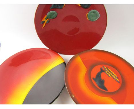 A Poole Pottery Eclipse charger, Dolphin charger and a Delphis charger, Collectors Club, each 40cm diameter, (3).