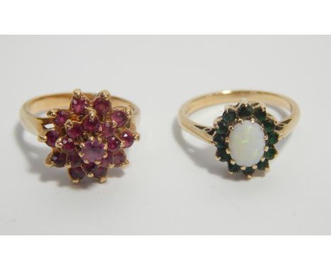 A yellow metal and amethyst cluster ring, stamped 9ct, size L, and a yellow metal opal and green garnet ring, stamped 9ct, si