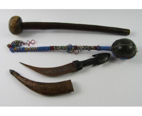 A tribal gourd stick, with bound beaded decoration, 41cm long, a knob kerry and an African hunting knife with an ebony handle