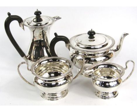 A George V silver four piece tea and coffee set, of baluster form with a reeded rim, London 1927, comprising teapot, coffee p