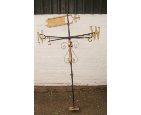 A cast iron Folk Art weather vane, with articulated cross top, on inverted sign post on turned stem and square base, 162cm hi