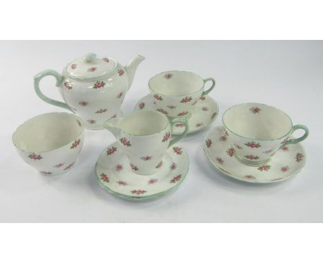 A Shelley Rosebud pattern early morning tea set, including teapot, milk jug, sugar basin, two cups and saucers, and two small