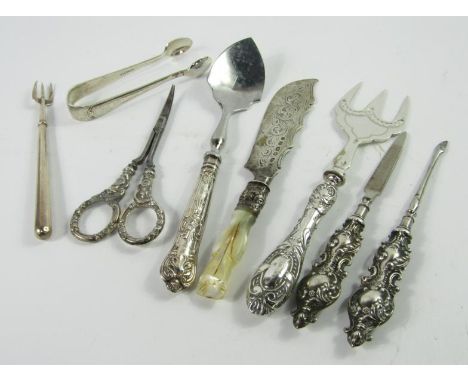 A Victorian silver butter knife, a silver handled bread fork, a silver handled preserve spoon, manicure implements, and silve