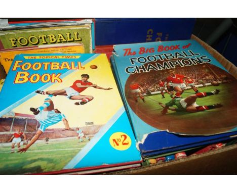 A collection of vintage soccer annuals, including Alan Ball's International Soccer Annual, The Big Book of Football Champions