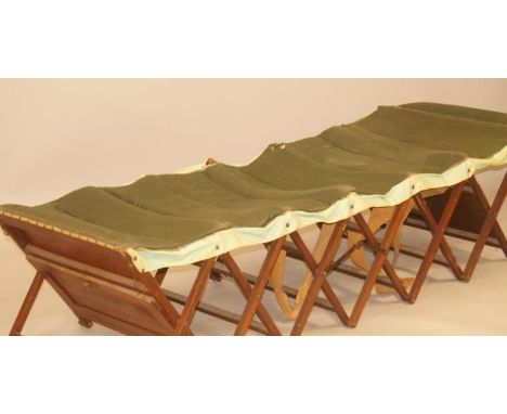 An early to mid 20thC mahogany and beech folding army or camp folding bed, 71cm wide.