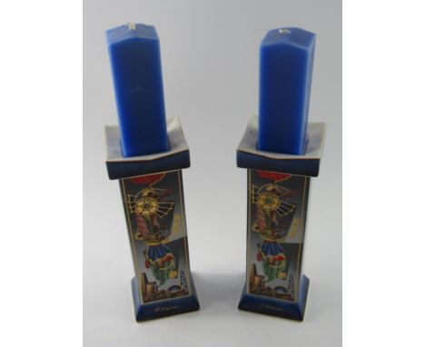 A pair of Goebel Artists Orbis candlestisks designed by P Kaplun, decorated in Der Stadtdrache pattern, limited edition No 02