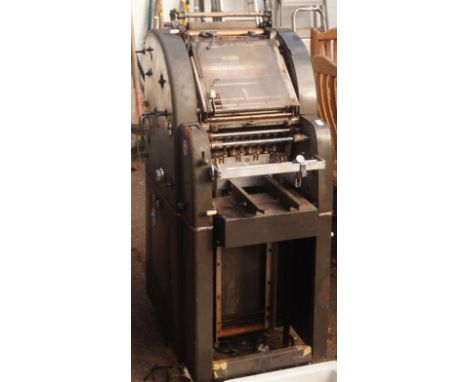 A B Dick offset 350 vintage printing press, of freestanding outline, metal casing, with articulated centre, 36cm high.