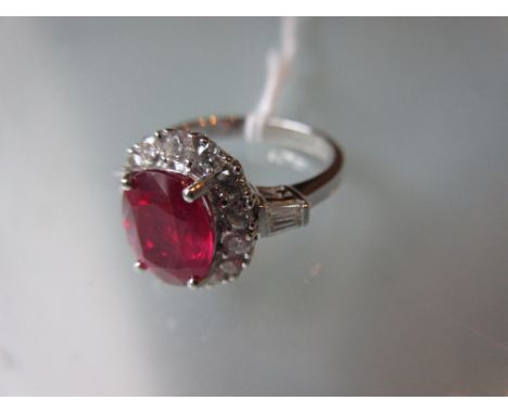 18ct White gold treated ruby and diamond cluster ring, the ruby approximately 2.40ct