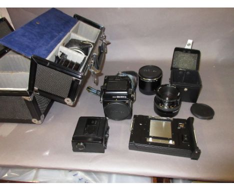 Zenza Bronica SQ- A medium format camera outfit with accessories including prism finder and polaroid film back