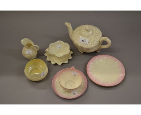 Belleek shell form teapot (unmarked) together with a shell form cup, saucer and plate (black mark), shell form cream jug and 