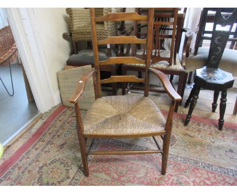 Early 20th Century Liberty style ladder back chair with rush seat together with a similar side chair