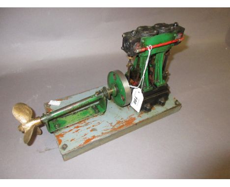 Twin piston vertical stationary engine with attached propeller