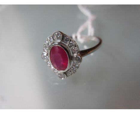 18ct White gold oval ruby and diamond cluster ring