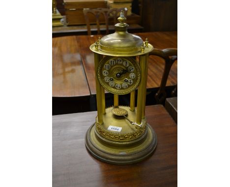 Circular gilt portico type clock having circular dial with Arabic numerals and two train movement striking on a bell