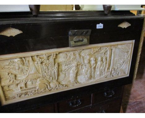 Oriental carved and lacquer decorated trunk with hinged cover