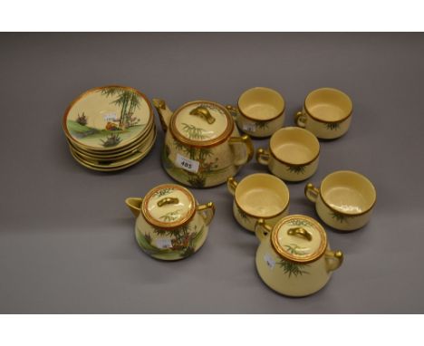 Late 19th or early 20th Century Satsuma five place setting tea service decorated with ducks and foliage, marked in red to the
