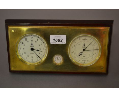 20th Century brass and mahogany weather station by Rigel, the brass front having three silvered dials including clock, barome