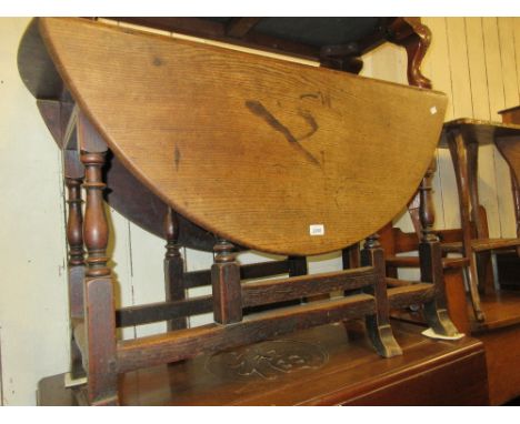 18th Century oak oval gate leg table having baluster turned supports with splayed feet