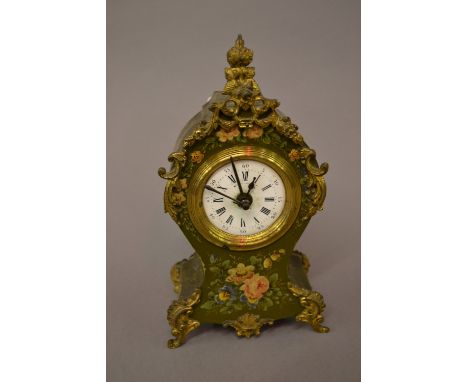 Small late 19th or early 20th Century French mantel clock with painted floral decoration on a green ground with gilt metal mo