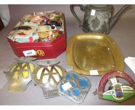 Four various car badges including RAC and AA, tin containing a quantity of buttons, plated teapot, brass tray etc