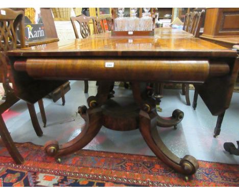 Late Regency rosewood and brass inlaid drop-leaf sofa table, the figured crossbanded top above a deep moulded frieze, the qua