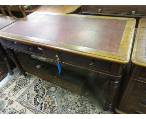 Good quality Victorian mahogany writing table, the rexine inset moulded top above two frieze drawers on turned tapering suppo