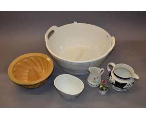 Large white porcelain two handled circular bowl, two ceramic jelly moulds, black and white Wedgwood style jug, smaller bisque