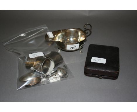 Silver sauce boat, pair of silver napkin rings, another napkin ring, small cased set of spoons and four various silver spoons