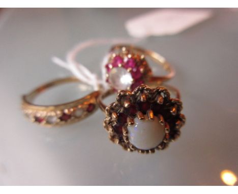 Two 9ct gold cluster dress rings together with a 9ct gold half hoop ring