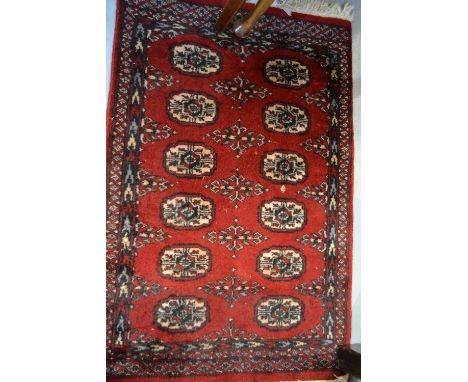 Small hand made rug having multiple gol design on a red ground with borders, 3ft x 2ft, together with a Persian style rug wit