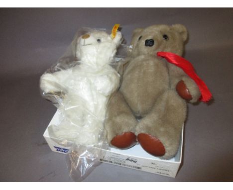 Modern Steiff white plush teddy bear together with another teddy bear