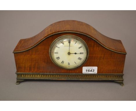 Edwardian mahogany dome shaped mantel clock, the enamel dial with Roman numerals, inscribed Mappin and Webb with a French mov