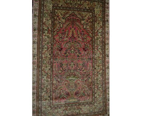 Small modern Persian silk prayer rug with a vase design on a pale pink ground with borders