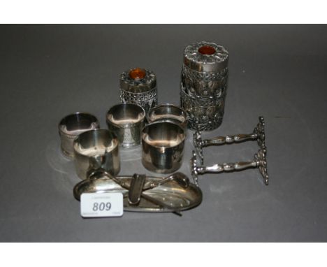 Two pairs of silver napkin rings together with another silver napkin ring, two continental white metal cylindrical boxes with