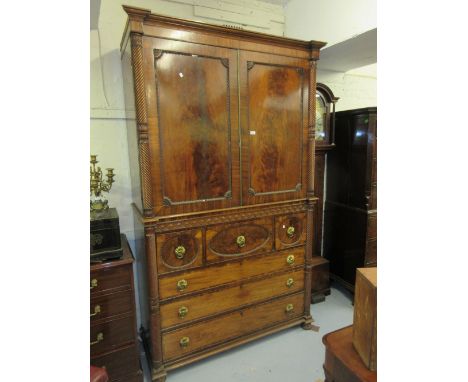 Fine quality William IV figured mahogany linen press, the moulded inverted breakfront cornice above a pair of panelled doors 