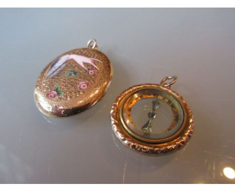 Victorian oval locket, enamel decorated with a hand together with a Victorian circular compass fob