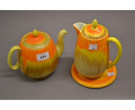 Shelley Volcano pattern teapot with stand, together with a matching hot water pot