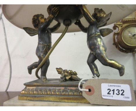 Gilded spelter lamp base in the form of winged cherubs on marble plinth together with a glass cornucopia type vase on marble 