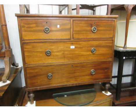 Small 19th Century mahogany straight front chest of two short and two long drawers with brass ring handles raised on low turn