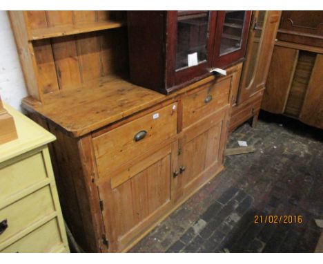 19th Century stripped and polished pine dresser with a boarded shelf back above two drawers and two panelled doors