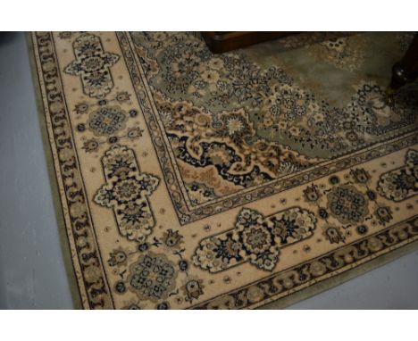Wilton type Persian style rug of Persian design on a green ground, 9ft x 12ft approximately