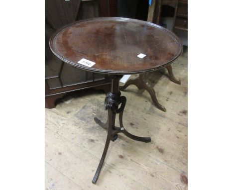 Edwardian mahogany wine table with a dish top and tripod base decorated with swags