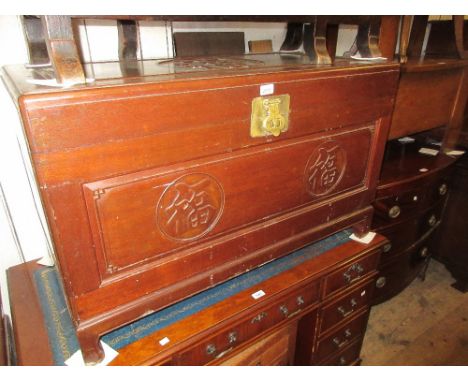 Large Chinese trunk with hinged cover having carved decoration 