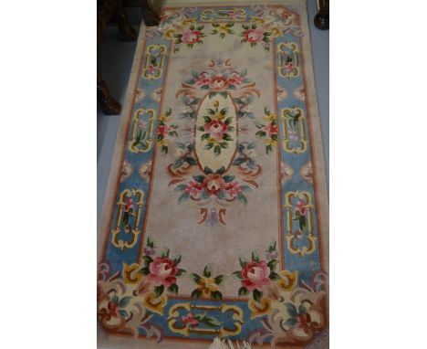 Small Chinese rug with beige ground together with a similar circular rug
