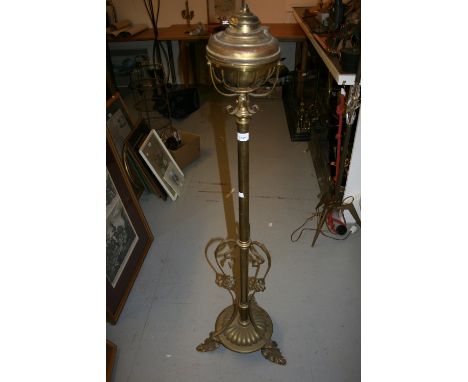 Edwardian brass oil lamp standard adapted for use with electricity with an Art Nouveau style tripod base