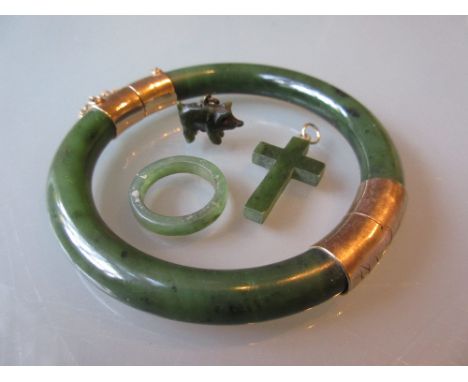 Gilt mounted jade bangle together with two jade charms and a ring