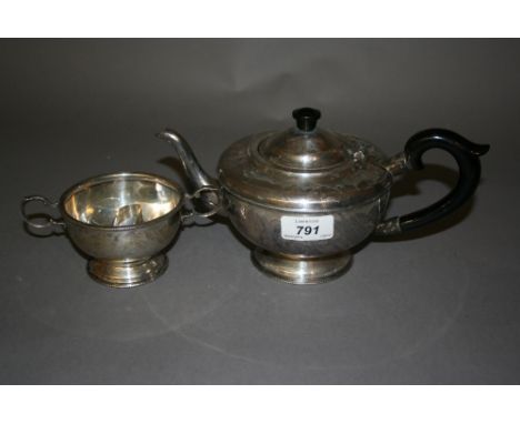 20th Century Birmingham silver circular teapot together with a matching two handled sugar basin