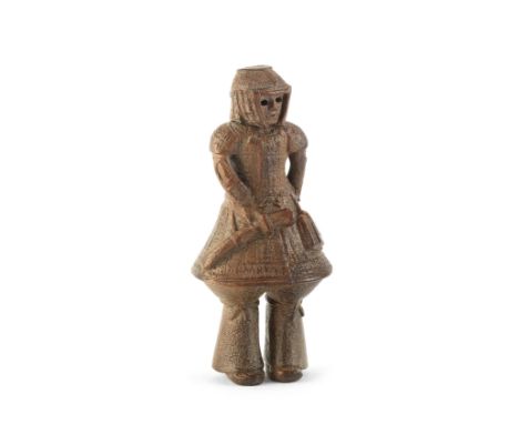 A Wood netsuke of a haniwa warriorBy Ouchi Sosui (1911-1972), Showa era (1926-1989), 20th centuryRendered in conventional for